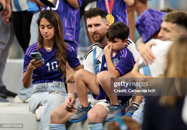 Lionel Messi of Argentina sits with his wife, Antonela Roccuzzo and son after the FIFA World Cup Qatar 2022 Final match between Argentina and France...