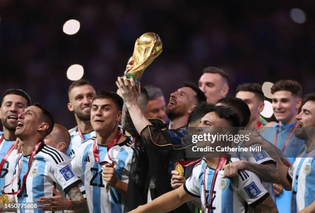 Lionel Messi of Argentina lifts the FIFA World Cup Winner's Trophy following the FIFA World Cup Qatar 2022 Final match between Argentina and France...
