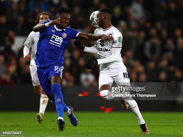 Mo Eisa of MK Dons and Daniel Amartey of Leicester battle for possession during the Carabao Cup Fourth Round match between Milton Keynes Dons and...