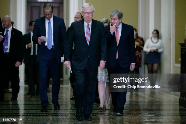 Senate Minority Leader Mitch McConnell is joined by Senate Minority Whip John Thune and Sen. Roy Blunt as they head to a news conference following...