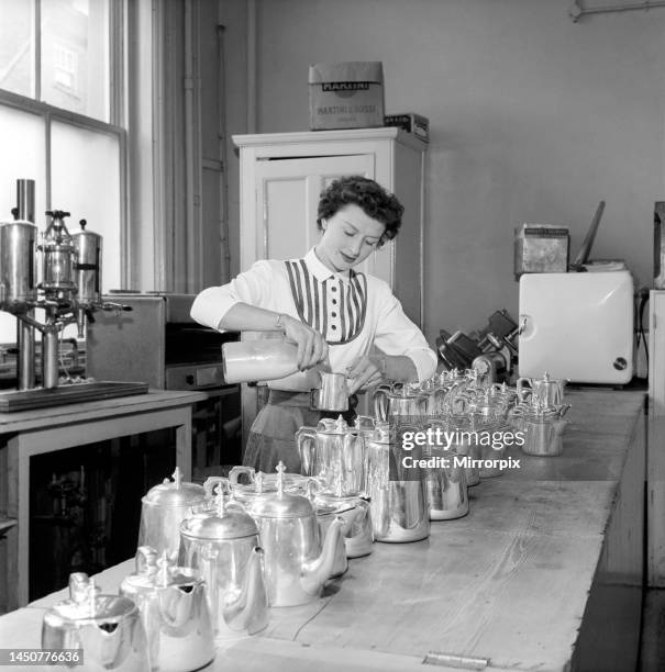 Woman seen here preparing pots of tea in a cafe, 1957.