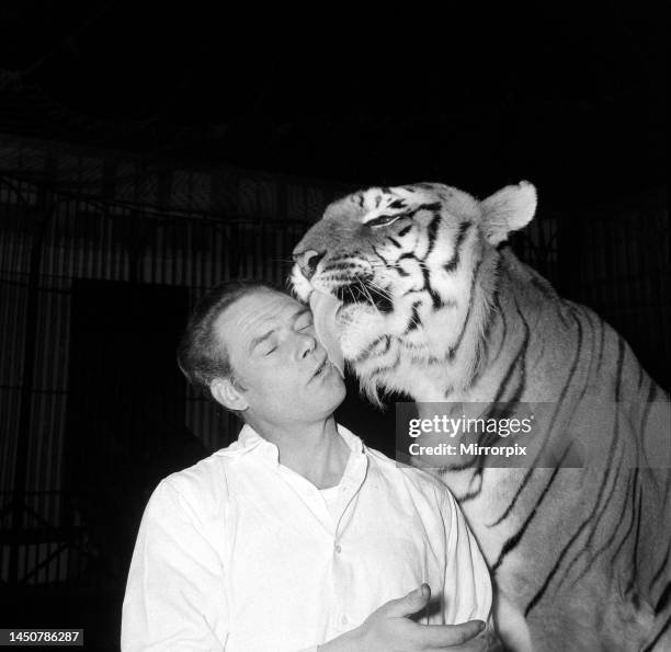 Alex Kerr and tiger Khan. December 1957.