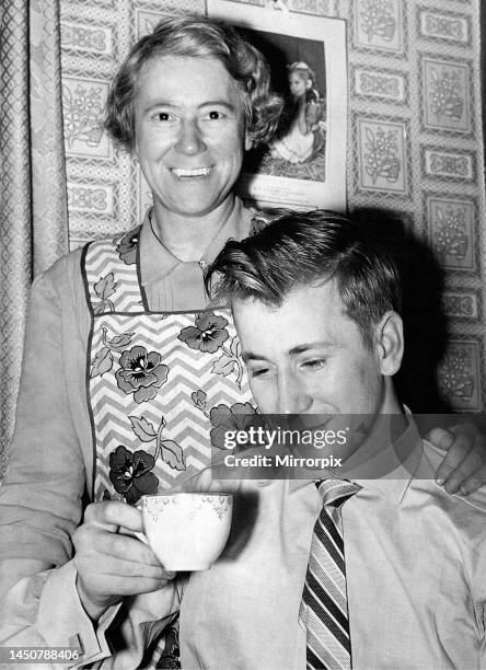 Bobby Charlton the Manchester United forward with his mother Cissie after his return home to Ashington from Munich in February 1958.