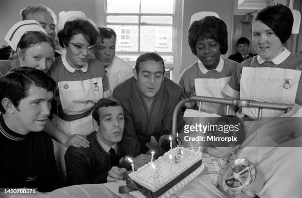 Liverpool players Ian Callaghan, Chris Lawler and Ian St. John visit a boy recovering from an operation at Alder Hey children's hospital. 3rd...