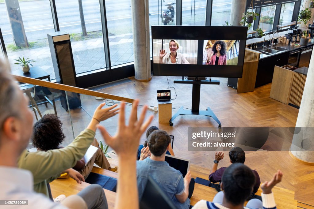 Startup business team having a hybrid conference meeting