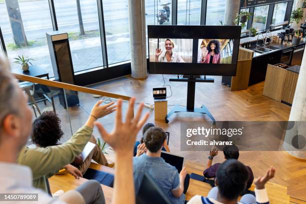 startup business team having a hybrid conference meeting - auditorium stock pictures, royalty-free photos & images