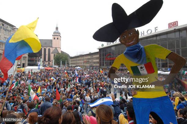 Hundreds of pilgrims gather on the place in front of the central station and near Cologne's cathedral, 16 August 2005, on the opening day of the...