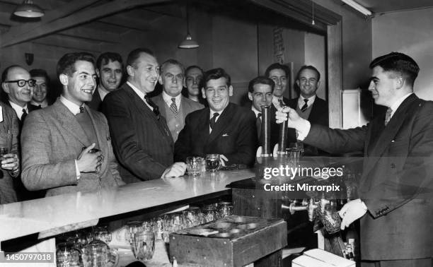 Members of Davenport Rugby league football club enjoy a pint of beer after a match. December 1957.