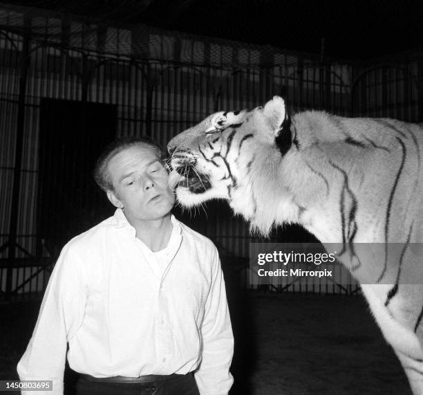 Alex Kerr and tiger Khan. December 1957.