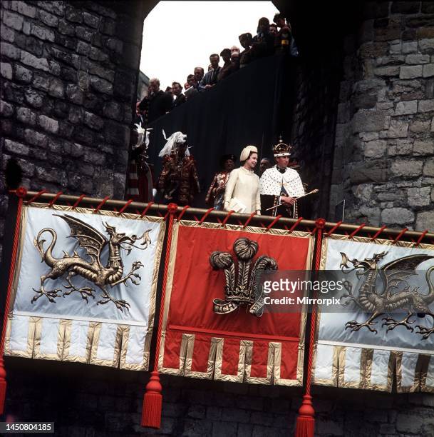 Investiture of Prince Charles as Prince of Wales . Queen presents Prince Charles to the people of Wales at Queen Eleanor's Gate Caernarfon Castle.
