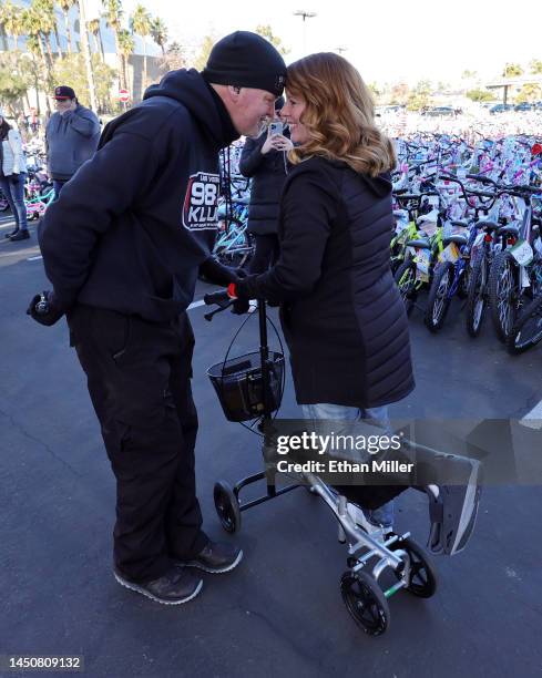 Chet Buchanan , host and creator of 98.5 KLUC's "The Chet Buchanan Show," greets his wife Amy Buchanan after he came down from a 30-foot scaffold on...