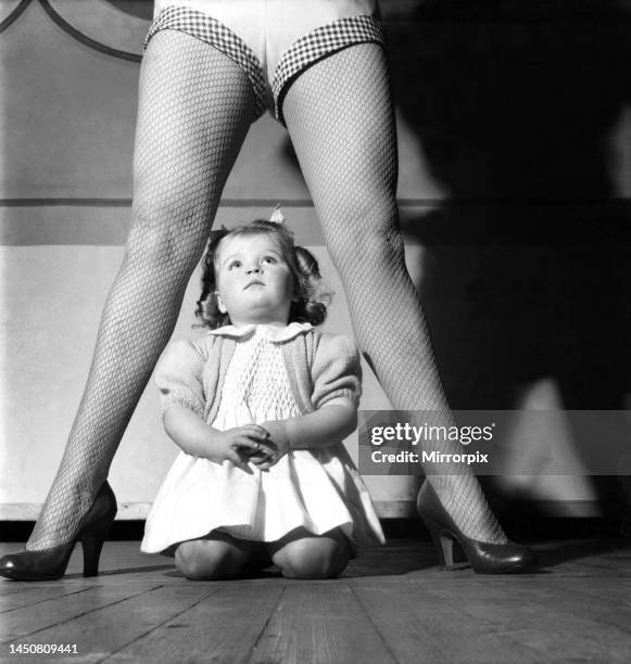 Sheila Hannaway, principal boy in Dick Whittington at Glasgow with her 2 year old daughter December 1953.