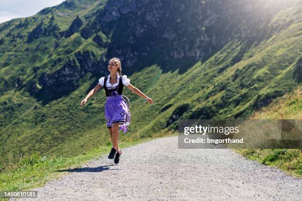 portrait of a teenage girl wearing traditional austrian dress - dirndl - traditionally austrian stock pictures, royalty-free photos & images