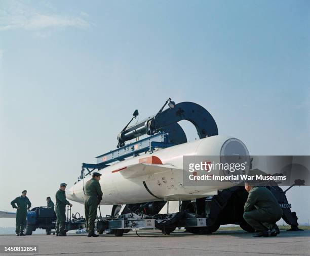 Nuclear Blue Steel SOM being lowered from a transporter on to a trolley prior to be loaded on an awaiting Handley Page Victor strategic bomber,...
