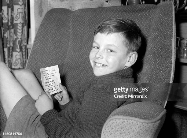 Young Fulham fan holds his ticket for the FA Cup 6th round match against Bristol Rovers. February 1958.