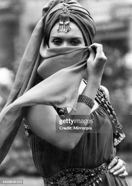 Complete harem gear may have been the coolest solution to Tuesday's 79 degrees, but this brown chiffon wrap, modelled by Pamela McCarthy, raised the...