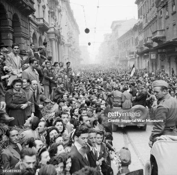 Cheering crowds gather in their thousands to greet Polish troops entering Bologna, Italy, 1945.