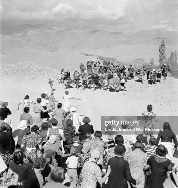 People from a Polish refugee camp in Persia greeting new arrivals, 1942. When Poland was attacked by the Nazis on 1 September, the Red Army also...