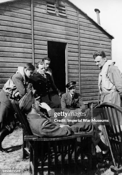 Pilots of No 303 Polish Fighter Squadron from left: Pilot Officer Witold 'Tolo' lokuciewski ; Flight Lieutenant Witold Urbanowicz ; Pilot Officer...