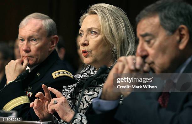 Secretary of State Hillary Clinton speaks as U.S. Defense Secretary Leon Panetta , and Chairman of the Joint Chiefs of Staff Martin Dempsey...