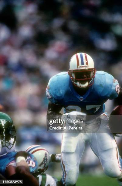 Running Back Eddie George of the Houston Oilers Carries the ball in the game between the Houston Oilers vs the New York Jets at Mississippi Veterans...