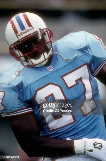 Running Back Eddie George of the Houston Oilers follows the action in the game between the Houston Oilers vs the New York Jets at Mississippi...