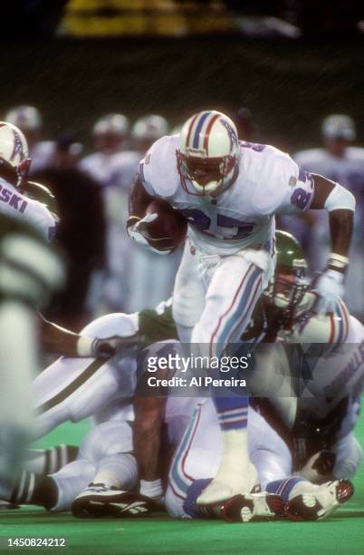 Running Back Eddie George of the Houston Oilers runs with the ball in the game between the Houston Oilers vs the New York Jets at The Meadowlands on...