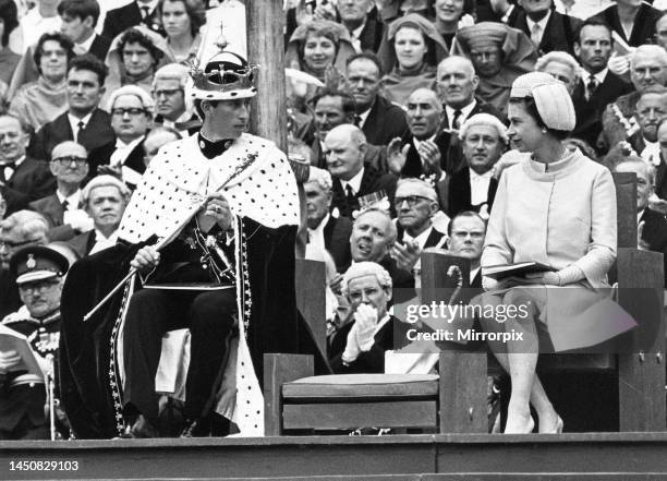 Prince Charles - Prince of Wales - Investiture of the Prince of Wales - Queen Elizabeth II looks at the Prince Charles during the ceremony when he...