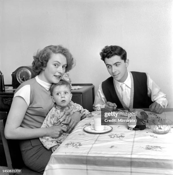 Mr and Mrs Hull with their son having tea. 1954.