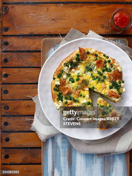 plate of pea and cheese quiche - quiche stock pictures, royalty-free photos & images