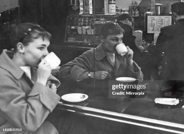 Judi Dench drinking coffee in cafe near the Old Vic theatre. 11 September 1957.