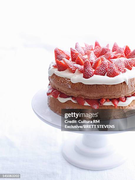 raspberry layer cake on platter - indulgence white background stockfoto's en -beelden