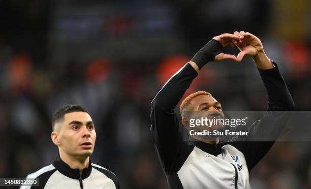 Newcastle player Joelinton makes a heart shape with his hands towards the crowd prior to the Carabao Cup Fourth Round match between Newcastle United...