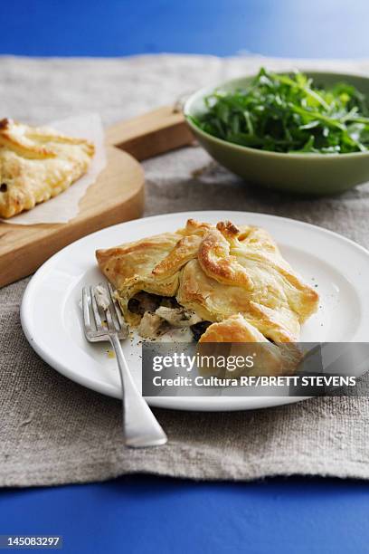 plate of spinach tallegio tart - puff pastry stock pictures, royalty-free photos & images