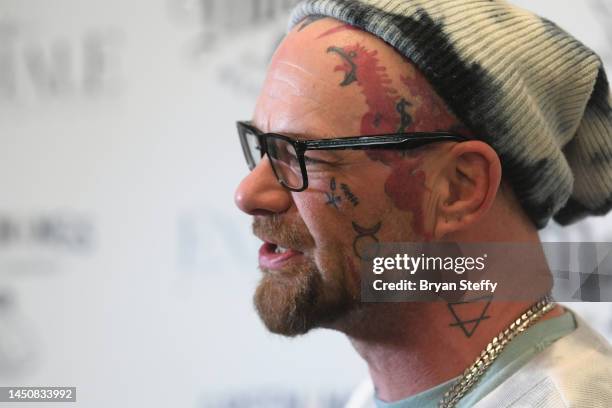 Singer Ivan Moody, tattoo detail, of Five Finger Death Punch poses during an appearance to celebrate the unveiling of his new cannabis wellness line...