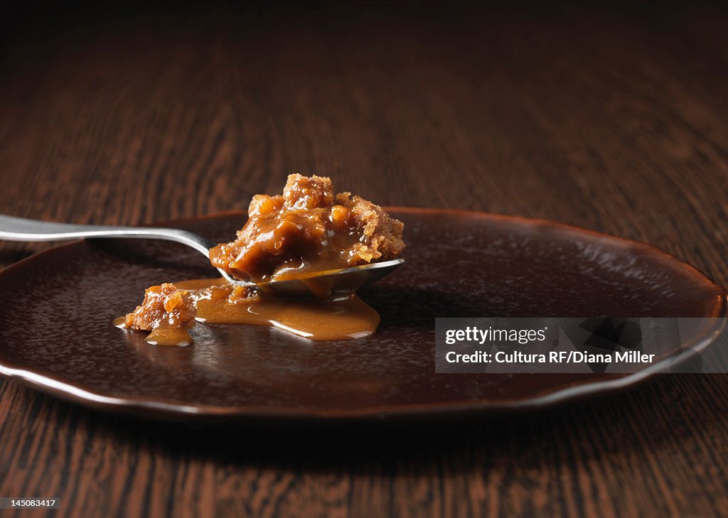 Spoonful of ginger dessert on plate