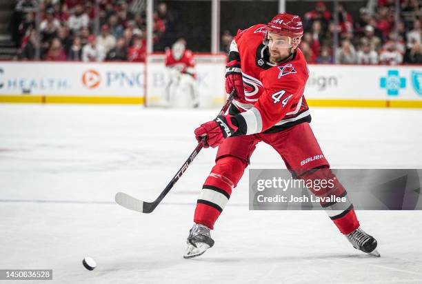 Calvin de Haan of the Carolina Hurricanes shoots the puck during the first period against the New Jersey Devils at PNC Arena on December 20, 2022 in...