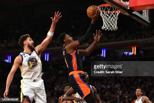 Barrett of the New York Knicks shoots a lay up against Klay Thompson of the Golden State Warriors during the third quarter of the game at Madison...