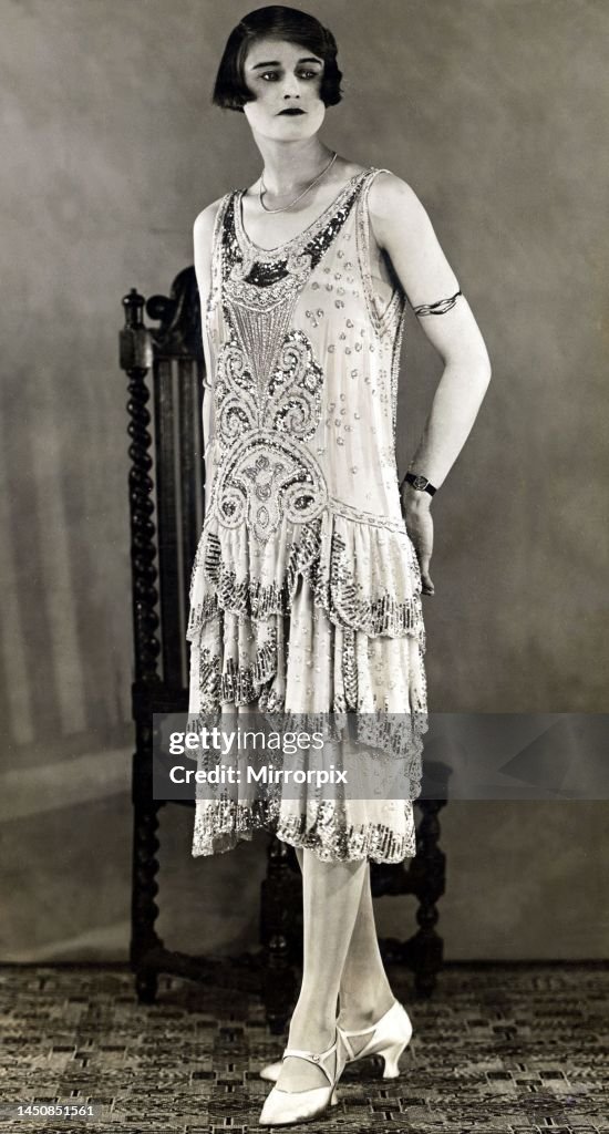 Eve Valere models an evening gown of paillette and diamante... News ...