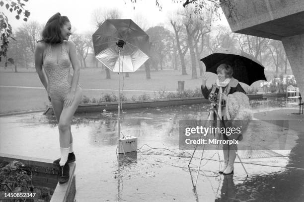 Model Marion Proffitt wearing a turquoise Lycra one-piece swimsuit, cut low at the sides, by Trend. This suit will be in the shops in the new year...