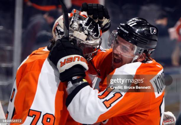 Carter Hart of the Philadelphia Flyers with the win and Travis Konecny with two goal celebrate their 5-3 win over the Columbus Blue Jackets at the...