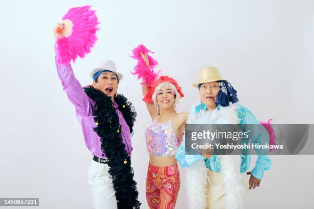 portrait of senior dancer - female with group of males stock pictures, royalty-free photos & images