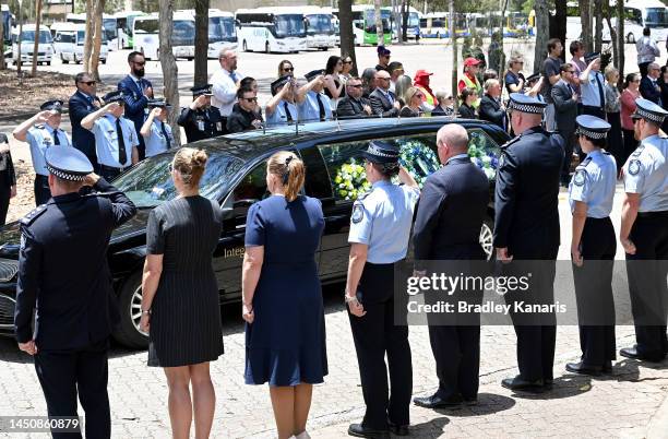 Guard of honour is seen as Police Officers pay their respects on December 21, 2022 in Brisbane, Australia. Constable Rachel McCrow and Constable...