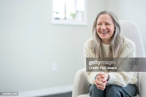 senior frau porträt - fat woman sitting on man stock-fotos und bilder