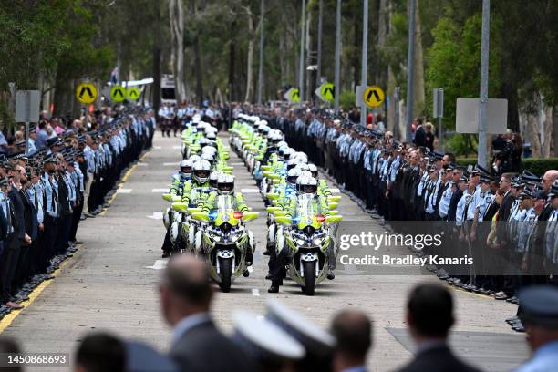 Guard of honour is seen as Police Officers pay their respects on December 21, 2022 in Brisbane, Australia. Constable Rachel McCrow and Constable...