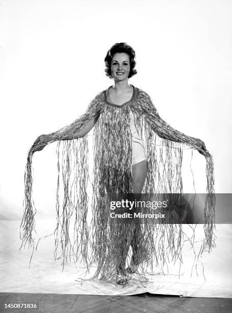 Roma Reeves wears a grass dress. Circa 1963.