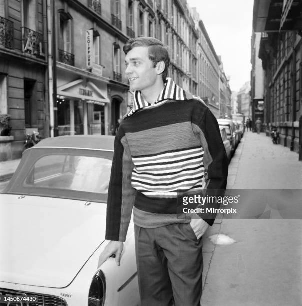 Man modelling the latest 1963 designs outside a Paris boutique. 25th April 1963.