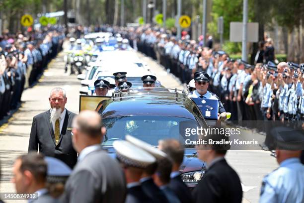 Guard of honour is seen as Police Officers pay their respects on December 21, 2022 in Brisbane, Australia. Constable Rachel McCrow and Constable...