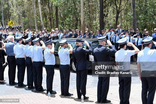 Guard of honour is seen as Police Officers pay their respects on December 21, 2022 in Brisbane, Australia. Constable Rachel McCrow and Constable...