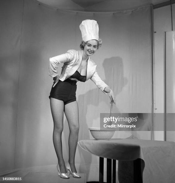 Model seen here in a chef's hat making pancake mix, Tuesday 1st March 1960.